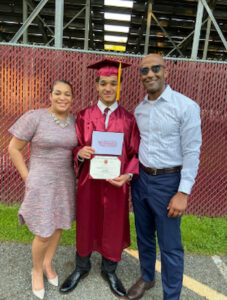 Brian Custer with his wife Carmen Custer and son during his sons graduation