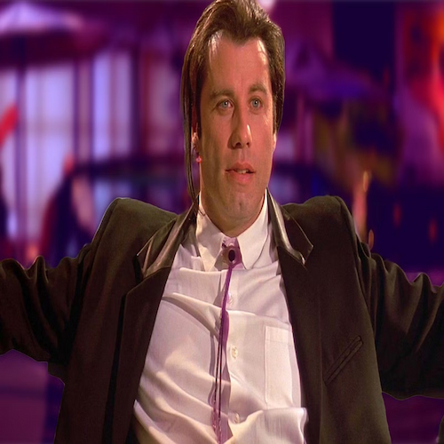 John Travolta-leaning-back-in-a-chair-in-pulp-fiction